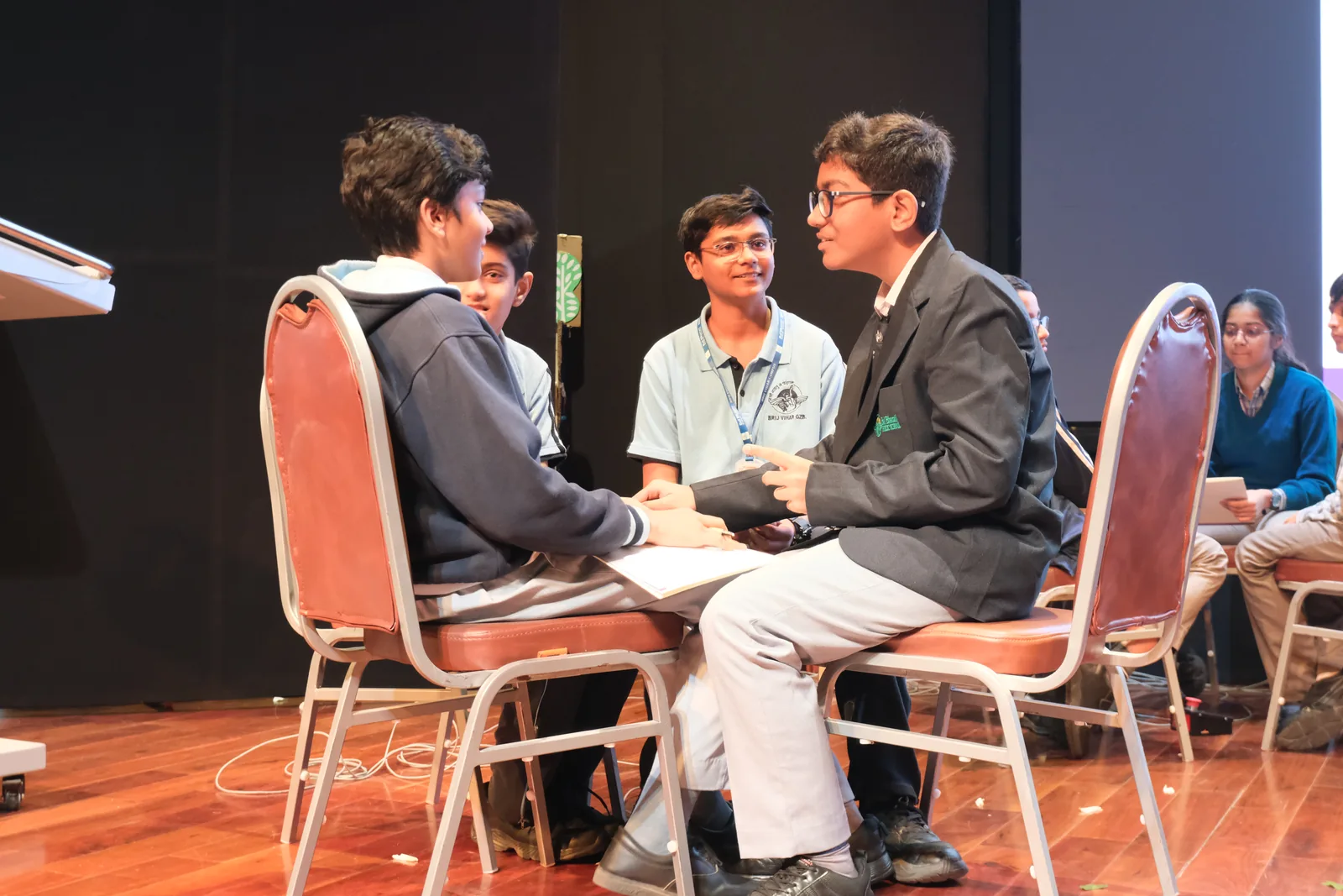 Young storytellers collaborating during a creative stage session